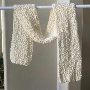 Cream colored knitted scarf